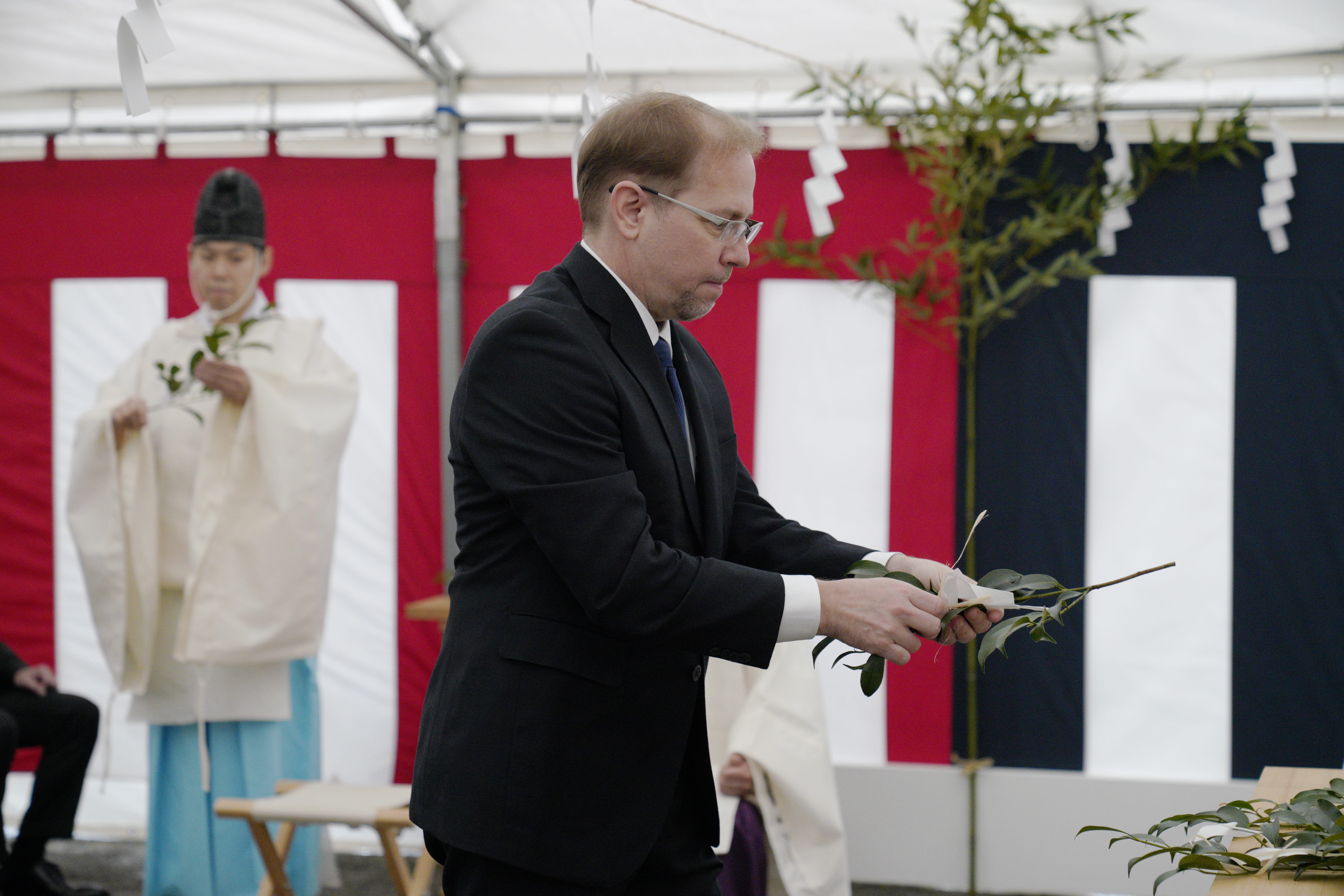 Photo of CEO James Kuffner participating in the safety prayer ceremony